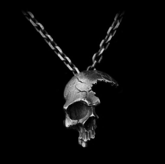 DAMAGED HALF FACE SKULL NECKLACE