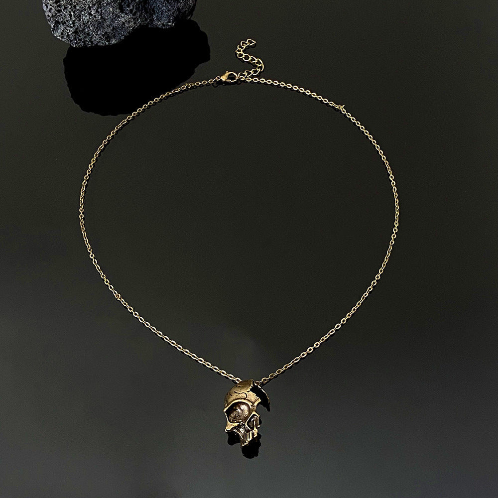 DAMAGED HALF FACE SKULL NECKLACE